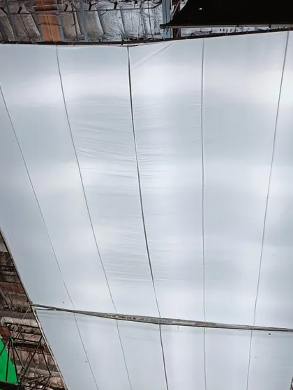 This large diffusion fabric, known as a butterfly, is stretched out to soften the light from multiple Creamsource SpaceX units. This technique is used to create a massive, ultra soft source for ambient skylight in a studio.