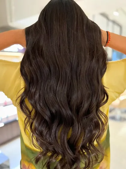 Peek-a-boo highlights are a fun way to add a hint of color. I used this technique for a subtle, two-tone effect on long hair with a face-framing haircut.