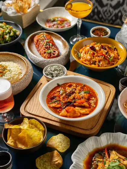 We excel at capturing large, complex table spreads that tell a story of abundance and variety. This overhead shot for a restaurant client showcases a full menu tasting, inviting viewers to imagine a shared dining experience.