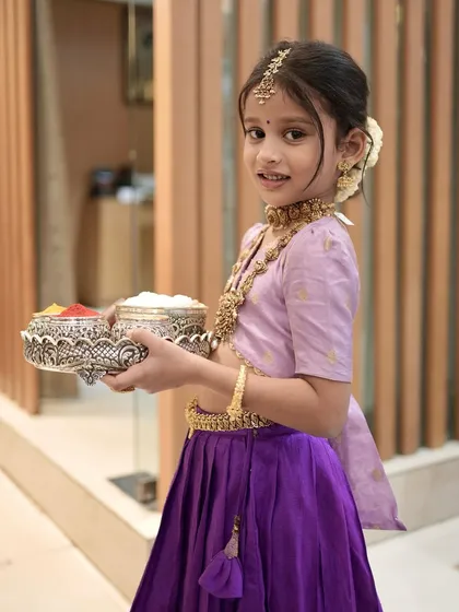 Another adorable shot of my little client, ready for the festival with her offering tray, dressed in her traditional best.