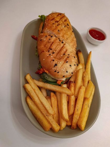 Looking for a fulfilling and affordable meal? Our peri-peri chicken sandwich combo with crispy fries is the perfect choice for a lazy afternoon.