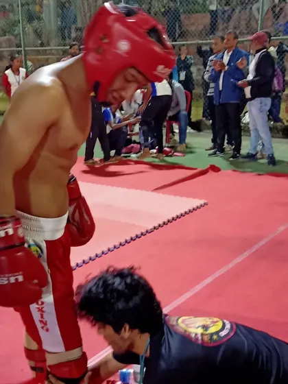 A moment of care from the coach between rounds is crucial for a fighter's performance.