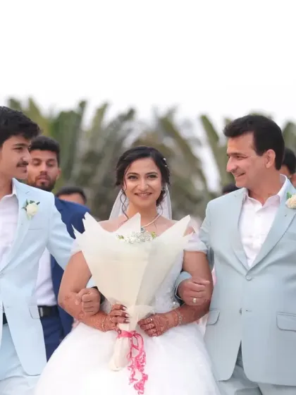 A heartwarming moment as the bride walks down the aisle for her Christian wedding. Her look is all about soft, romantic elegance, with a delicate updo and natural makeup that enhances her glow without overpowering her beautiful white gown.