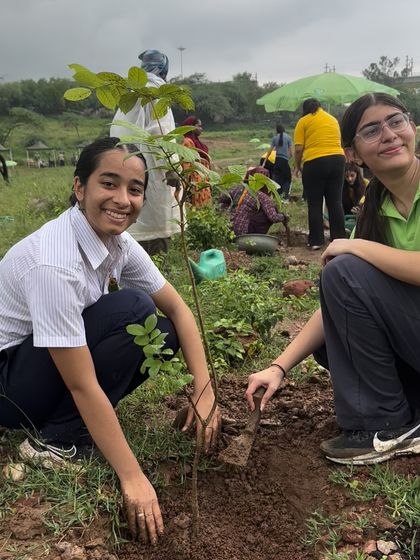 Students from The Shri Ram School Moulsari smile as they plant a native Aravali sapling. Engaging the youth is key to ensuring a sustainable future for Gurgaon's green spaces.