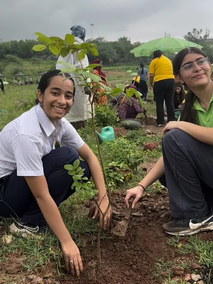 Students from The Shri Ram School Moulsari smile as they plant a native Aravali sapling. Engaging the youth is key to ensuring a sustainable future for Gurgaon's green spaces.