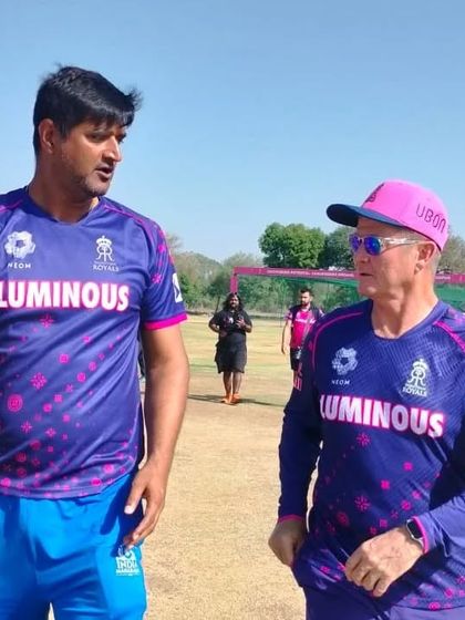 Here I am discussing coaching strategies with a fellow mentor on the field. We believe in a collaborative approach, constantly sharing knowledge to ensure our players receive the most current and effective training.