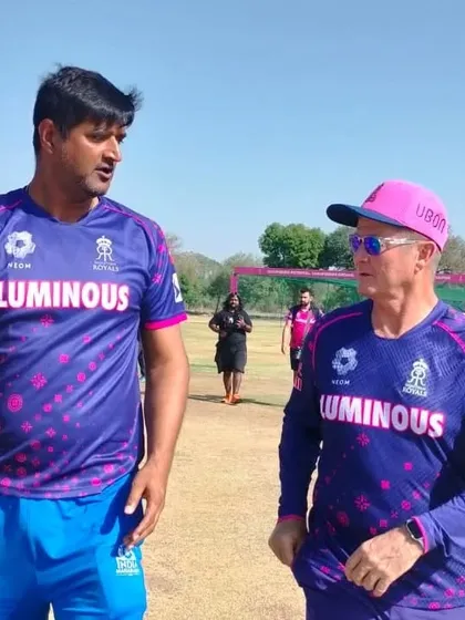 Here I am discussing coaching strategies with a fellow mentor on the field. We believe in a collaborative approach, constantly sharing knowledge to ensure our players receive the most current and effective training.