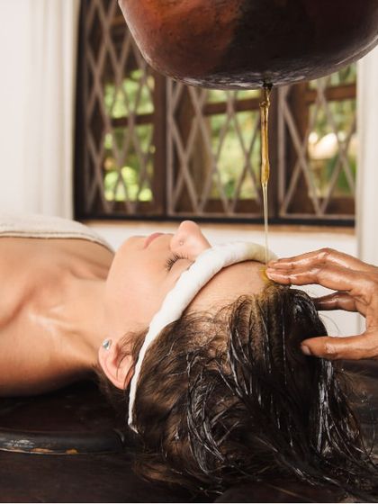 This is a duplicate of ID 19, showing a Shirodhara treatment. This therapy is excellent for hair care as it calms the nervous system, reduces stress-related hair fall, and nourishes the scalp with medicated oils like Neelibhringadi.