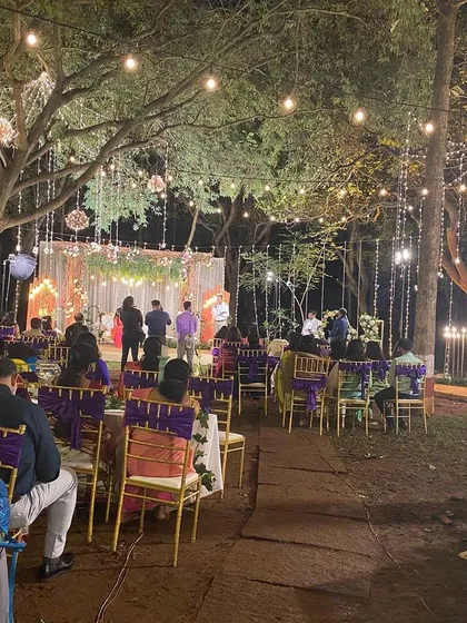 An enchanting outdoor wedding reception we catered at the Ecumenical Christian Center. We work with you to create a magical atmosphere with beautiful lighting and elegant seating that complements our delicious food.