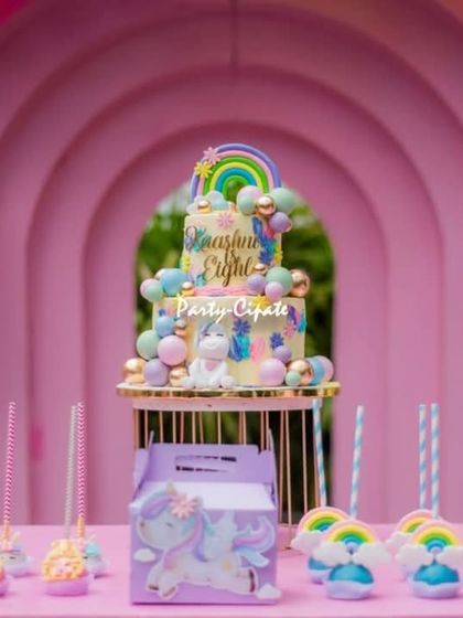 The dessert table was a rainbow of sweetness, with a stunning unicorn cake, rainbow cake pops, and other themed treats.