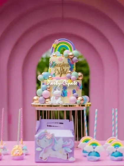 The dessert table was a rainbow of sweetness, with a stunning unicorn cake, rainbow cake pops, and other themed treats.