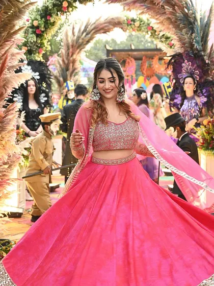 A vibrant shot from a wedding event in a stunning pink lehenga. This is a great example of high-quality event and ethnic wear content that resonates with my audience.