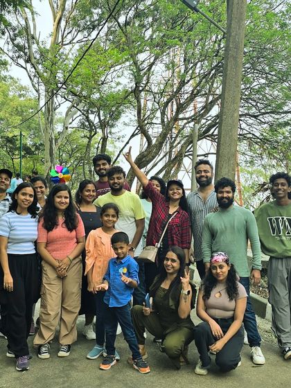 A group photo from a day trip, full of smiles and happy travelers.