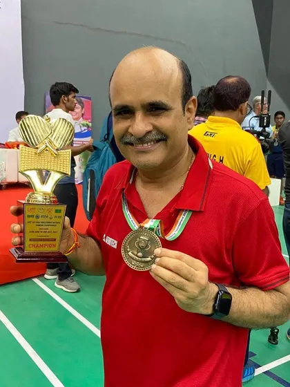 A close-up of Gajanan Parmar with his champion's trophy and gold medal from the UTT 1st Para Table Tennis National Ranking Championship.