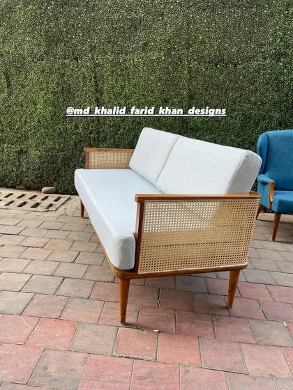 Side view of the caned sofa.