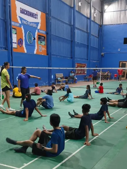 A coaching session in progress at our new Meerut academy. This image shows young players during a cool down stretch, highlighting the structured training programs we offer.