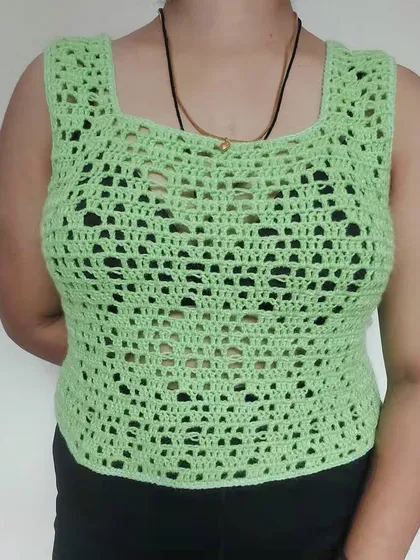 A closer look at the distressed mesh pattern, which adds texture and visual interest to this simple tank top.