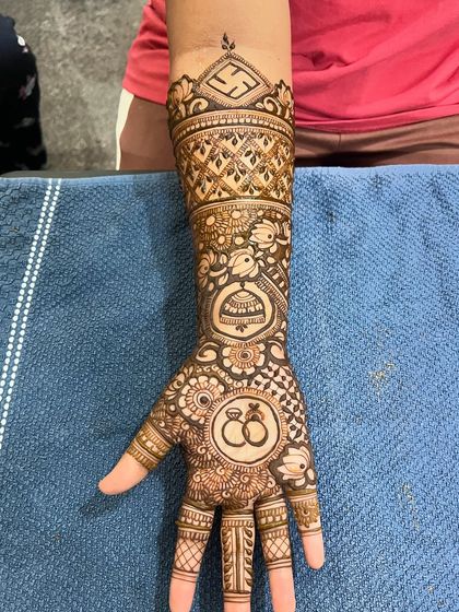 A close-up of the hand with the interlocking rings, a popular symbol for engagements.