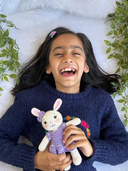 A lovely bunny in a purple dress with a custom initial "Q" on it. I made a similar one for my own daughter's birthday, and she absolutely adores it!