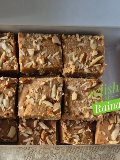 A close-up shot of my Gur Padi, showing the flaky texture and the generous topping of almond slivers.