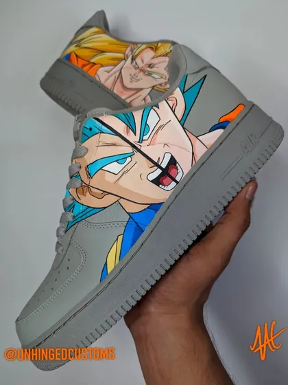 A powerful design on grey Air Force 1s, with Super Saiyan Blue Vegeta on one shoe and Super Saiyan Goku on the other. A classic rivalry captured in sneaker form.
