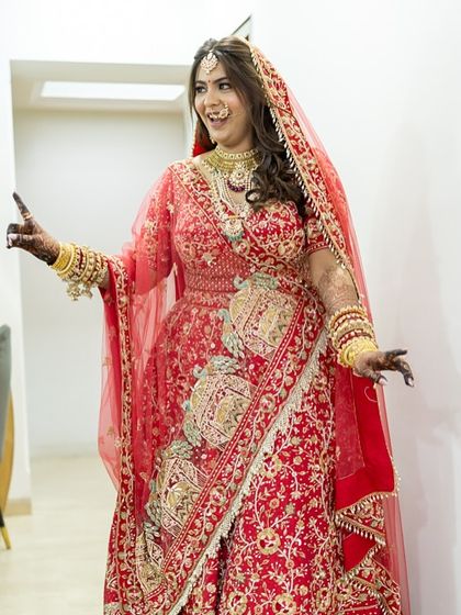 A fun, candid shot of the bride. Her long-lasting makeup ensures she can be herself and enjoy her day without any touch-up worries.