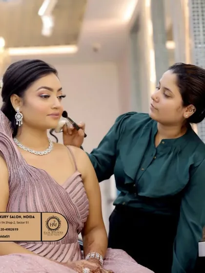 A behind-the-scenes glimpse of the care and precision that goes into every look. Here, I'm applying finishing touches to an engagement makeup look, ensuring a flawless, airbrushed finish using premium products from brands like NARS and MAC.