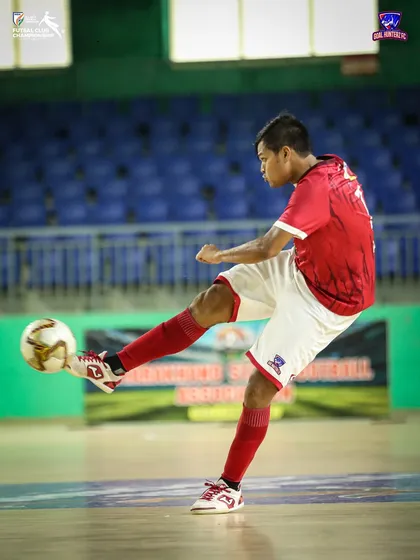 A player taking a shot during the match.