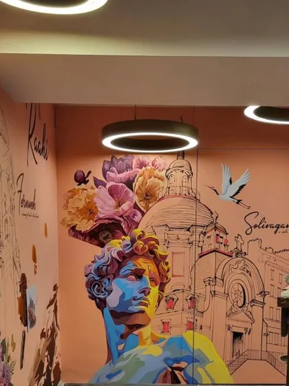 For the travel-themed restaurant 'Raahi', we designed a mural that captures the spirit of wanderlust. This piece blends classical art references with modern, colorful portraits and architectural sketches, creating a dynamic backdrop that tells a story of adventure and discovery.