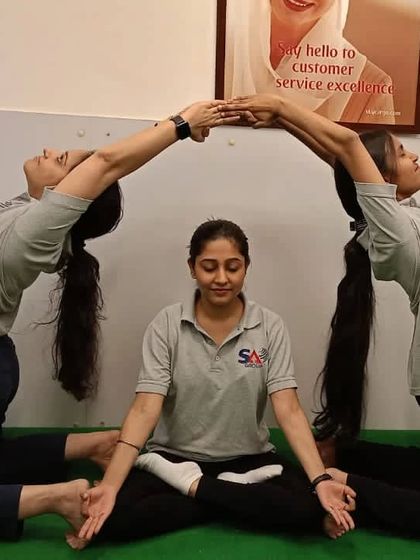 A beautiful group pose from our corporate yoga session at SA Consultant Pvt. Ltd.