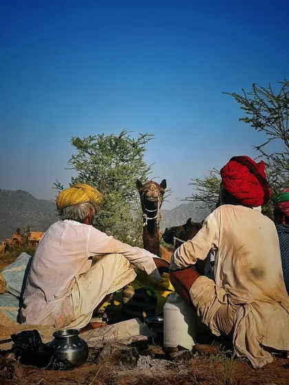 Two traders sharing a quiet moment with their camel. These are the intimate, slice-of-life scenes that I believe truly capture the essence of a place.