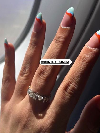 We love seeing our nails on the go. A client shared this shot of her colourful abstract nails from a plane window, perfectly capturing the vacation spirit.