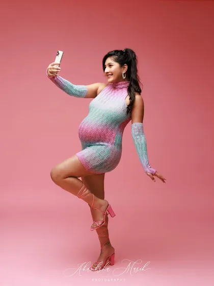 A playful selfie moment during our Barbie-themed shoot, capturing the fun and modern spirit of this mom-to-be.