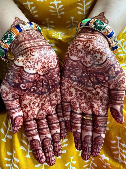 The palm side, showing the rich, dark color of the developed henna.