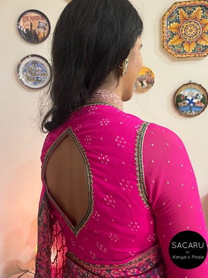 A side view of the elegant full-sleeve blouse, highlighting the fit and the unique back cutout design.