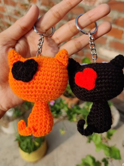 My quirky kitty keychains are for all the cat lovers out there. I make them in black and orange, with options for heart-shaped patches or wide-eyed expressions.