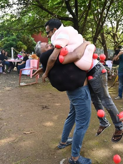 A hilarious moment from one of our custom-designed outdoor games. My goal is to create activities that are not only about teamwork but also about creating funny, shareable memories for the employees.