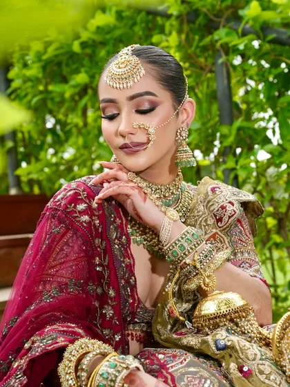 A vision of an ethereal queen. This close-up shot with eyes closed highlights the radiant skin and flawless eyeshadow blending, creating a moment of serene grace and grandeur.