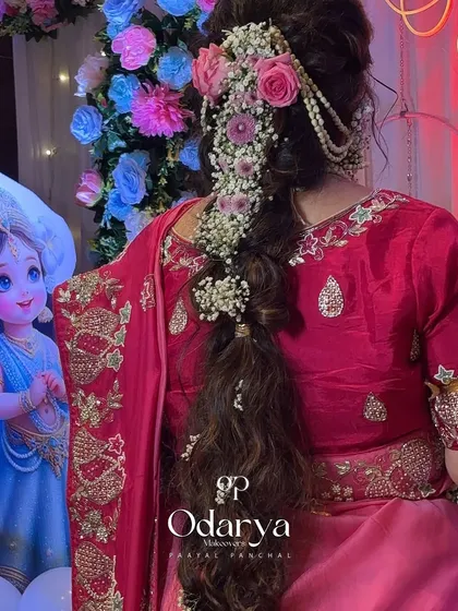 A real-life Rapunzel. This long, floral braid was the star of the show for her baby shower celebration.