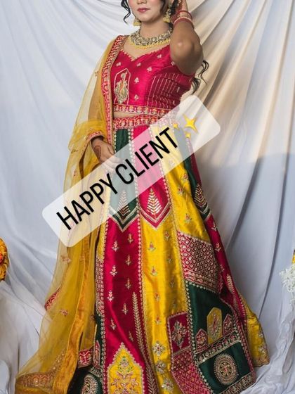 This happy client looks radiant in a multi-colored lehenga, a fantastic choice for a vibrant Mehendi party.