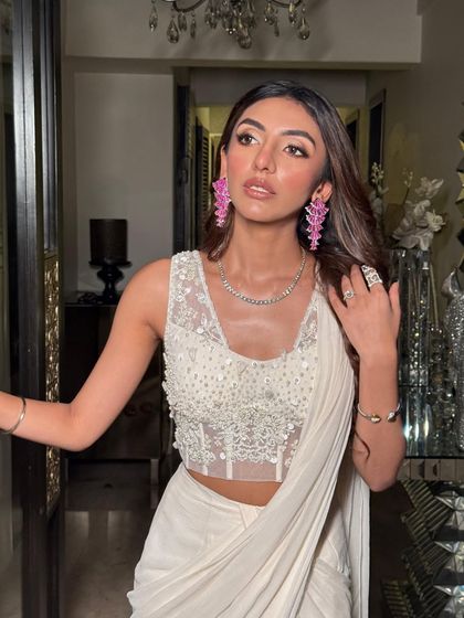 This angle highlights the soft contour and the luminous finish on her skin.