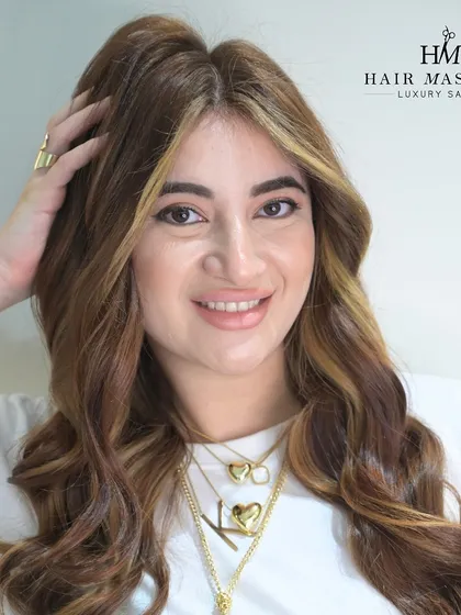 This client is radiating happiness with her new honey blonde highlights. The warm, golden tones are woven through her hair to create a sun-kissed, dimensional look.