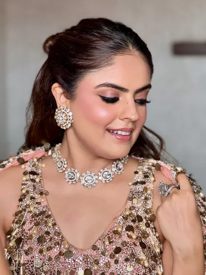 Another beautiful angle of the soft peach glam. The focus is on luminous skin and softly defined eyes, creating a look that's both modern and romantic.