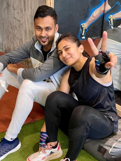 A candid moment with my coach. It's not just about the training plans; it's about the mentorship and friendship that we build along the way.