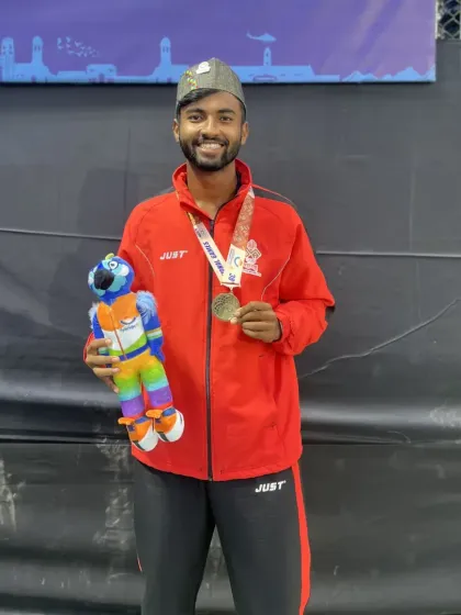 Our trainee Anup Bangargi with his bronze medal and mascot from the 38th National Games.