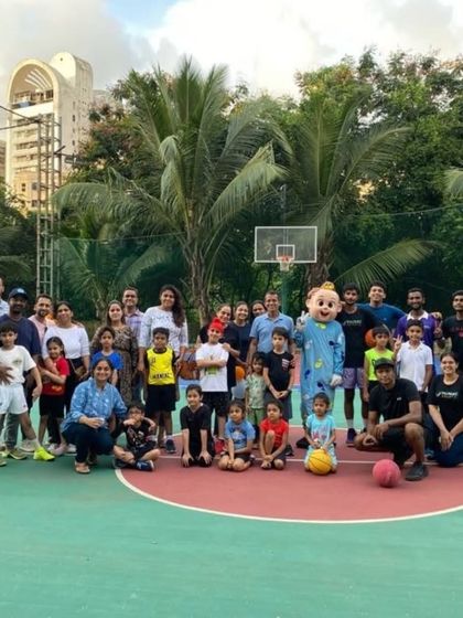 A group photo of players, parents, and coaches at "The Carnival." These events are a true celebration of the Maniac family.