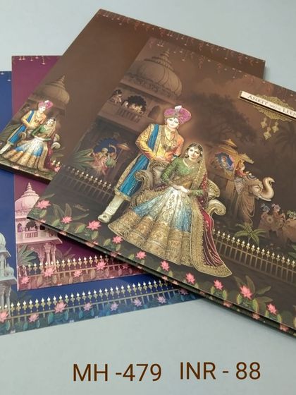 This invitation showcases a royal couple in a garden setting, with inserts available in multiple rich colors. The gold foil details add a touch of luxury to the design.