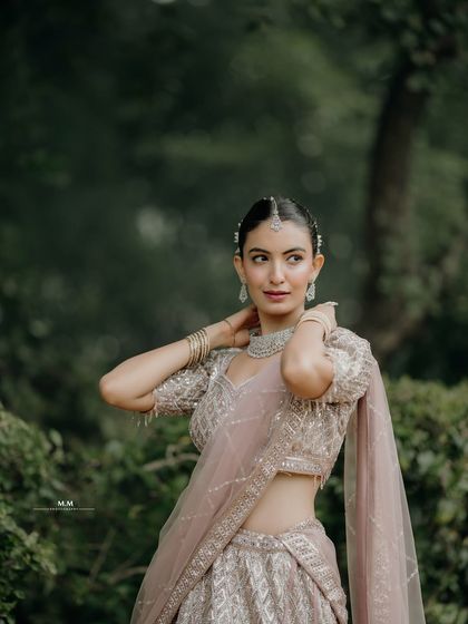 A confident and poised portrait. The bride's elegant posture and the soft lighting create a stunning and timeless image.