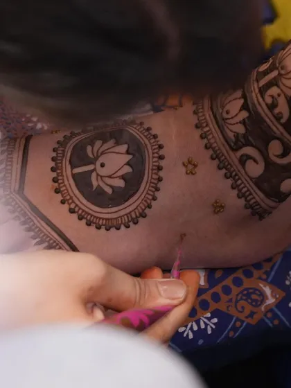 A close-up of my process, carefully drawing a lotus motif. Every line is drawn with precision and care to create a flawless and beautiful piece of art on your skin.