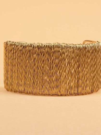The woven gold cuff bracelet from a different angle.